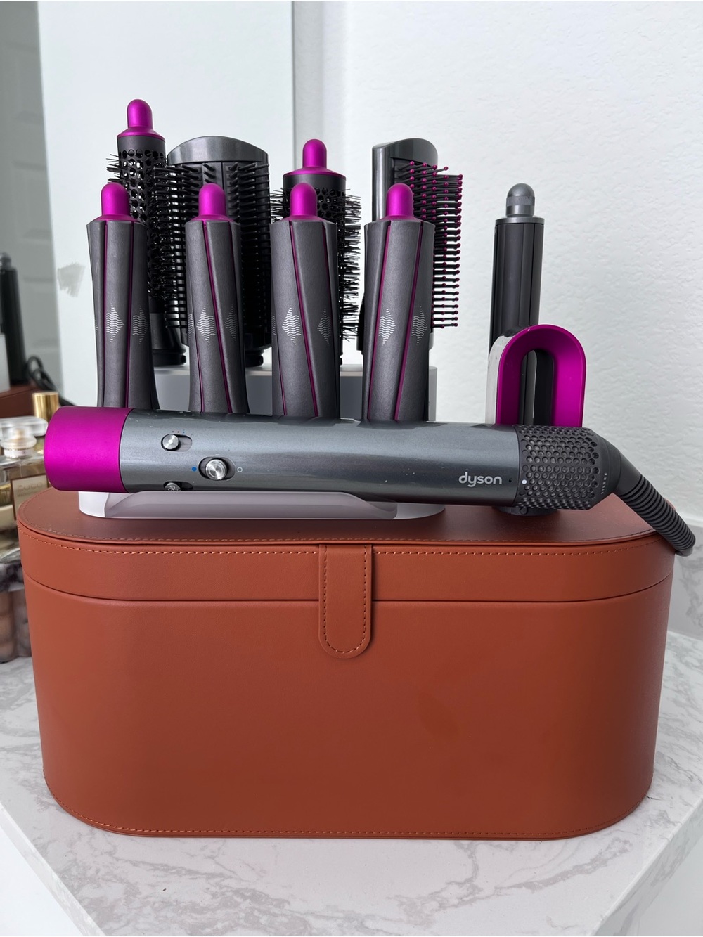 Dyson Airwrap with extra attachment that does curls towards and away from face.
